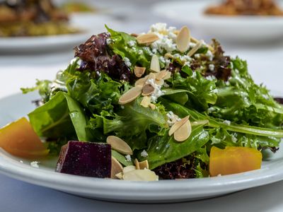 Golden and red beet salad with baby greens, goat cheese and roasted almonds