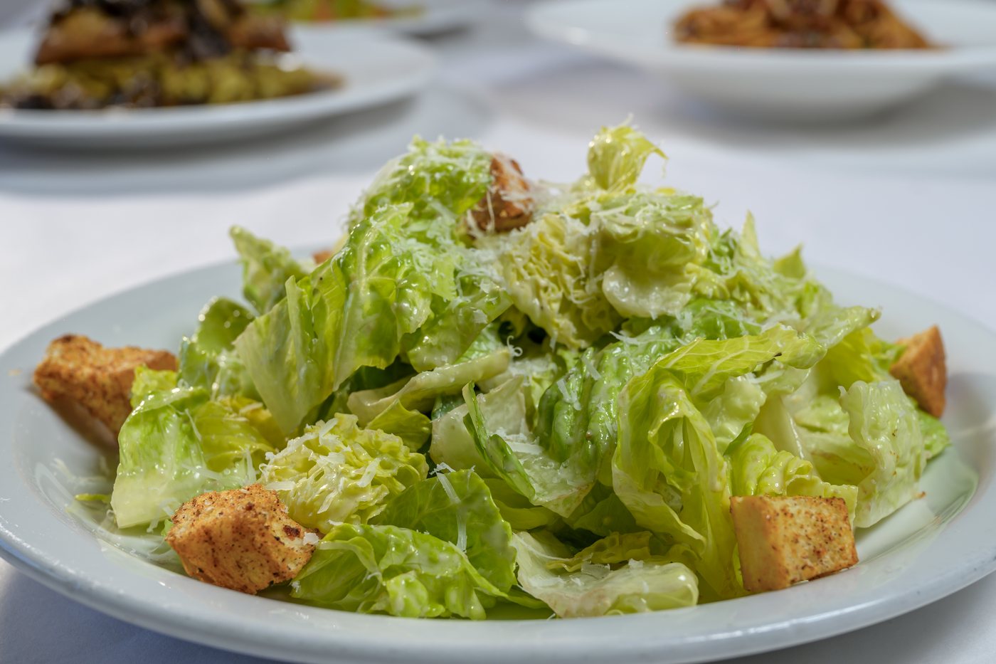 Caesar salad with romaine, croutons and shaved parmesan