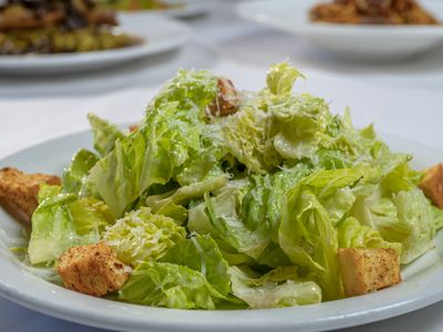 Caesar salad with romaine, croutons and shaved parmesan