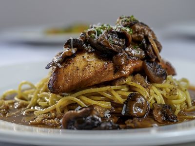 Sauteed chicken breast in mushroom marsala wine sauce over spaghetti