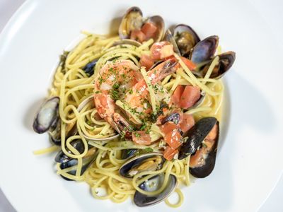 Linguine with prawns, mussels, clams and tomatoes in a herb white wine broth