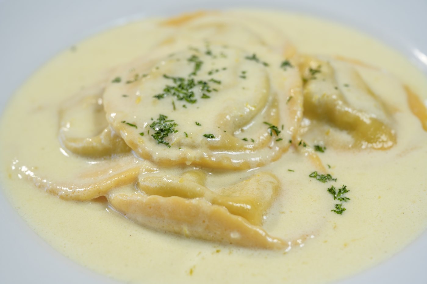 House made spinach and ricotta ravioli in a citrus cream sauce