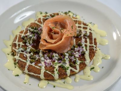 Smoked salmon with capers and red onion on a sweet corn pancake with lemon aioli