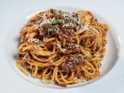 Spaghetti bolognese with ground pork, beef and caramelized onions in herb marinara