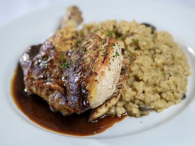 Roasted chicken over wild mushroom risotto with pan jus