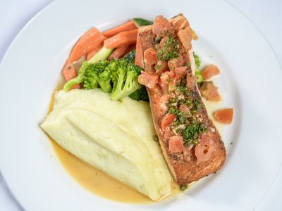 Pan seared salmon with mashed potatoes and seasonal vegetables